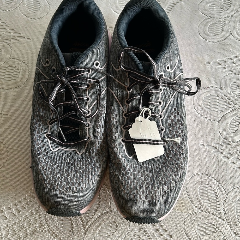 Woman’s Sneakers size 11.5 Grey with pink sole.